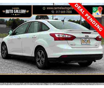 2014 Ford Focus SE is a White 2014 Ford Focus SE Sedan in Carmel IN