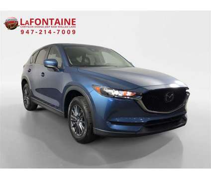 2021 Mazda CX-5 Touring is a Blue 2021 Mazda CX-5 Touring SUV in Walled Lake MI