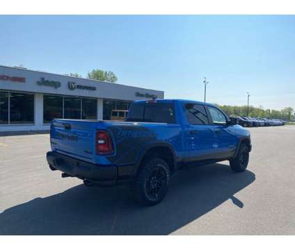 2025 Ram 1500 Rebel is a Blue 2025 RAM 1500 Model Rebel Truck in Houghton Lake MI
