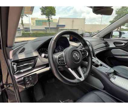 2021 Acura RDX Technology Package is a Black 2021 Acura RDX Technology Package SUV in Houston TX