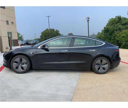 2019 Tesla Model 3 Mid Range is a Black 2019 Tesla Model 3 Sedan in Brenham TX
