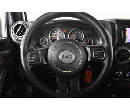 2015 Jeep Wrangler Sport is a Silver 2015 Jeep Wrangler Sport SUV in Orlando FL
