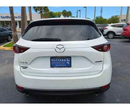 2021 Mazda CX-5 Sport is a White 2021 Mazda CX-5 Sport SUV in Daytona Beach FL