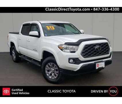 2019 Toyota Tacoma SR5 is a White 2019 Toyota Tacoma SR5 Car for Sale in Waukegan IL