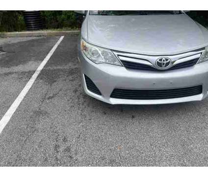 2013 Toyota Camry LE is a Silver 2013 Toyota Camry LE Car for Sale in Warwick RI