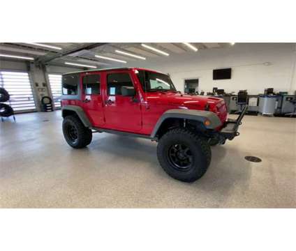 2014 Jeep Wrangler Unlimited Rubicon is a Red 2014 Jeep Wrangler Unlimited Rubicon SUV in Colorado Springs CO