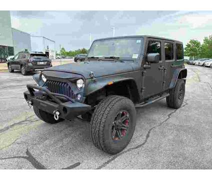 2014 Jeep Wrangler Unlimited Sport is a Black 2014 Jeep Wrangler Unlimited SUV in Peoria IL