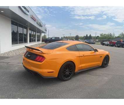 2018 Ford Mustang GT Premium is a Orange 2018 Ford Mustang GT Premium Coupe in Houghton Lake MI