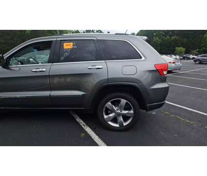 2013 Jeep Grand Cherokee for sale is a Grey 2013 Jeep grand cherokee Car for Sale in Charlotte NC
