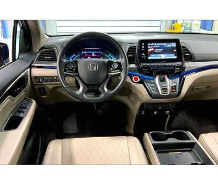 2021 Honda Odyssey Elite is a Red 2021 Honda Odyssey Elite Car for Sale in Capitol Heights MD
