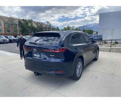 2024 Mazda CX-90 PHEV Preferred is a Blue 2024 Mazda CX-9 SUV in Sandy UT