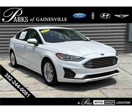 2020 Ford Fusion SE is a White 2020 Ford Fusion SE Sedan in Gainesville FL