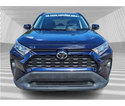 2021 Toyota RAV4 XLE is a Blue 2021 Toyota RAV4 XLE SUV in Fort Lauderdale FL