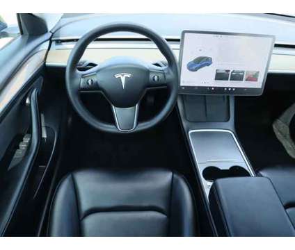 2022 Tesla Model 3 Long Range Dual Motor All-Wheel Drive is a Blue 2022 Tesla Model 3 Long Range Sedan in Friendswood TX