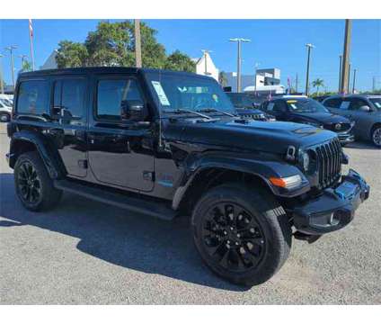 2021 Jeep Wrangler Unlimited Sahara 4xe is a Black 2021 Jeep Wrangler Unlimited Sahara SUV in Naples FL