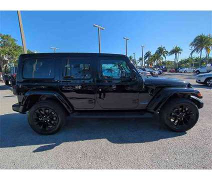 2021 Jeep Wrangler Unlimited Sahara 4xe is a Black 2021 Jeep Wrangler Unlimited Sahara SUV in Naples FL