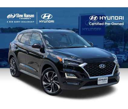 2021 Hyundai Tucson Sport is a Black 2021 Hyundai Tucson Sport SUV in Clive IA