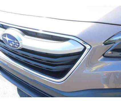 2022 Subaru Outback Premium is a Tan 2022 Subaru Outback 2.5i Station Wagon in Lansing MI