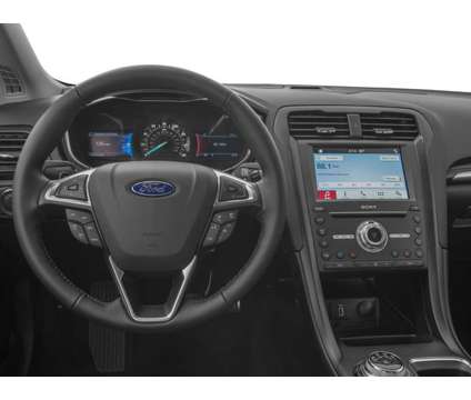 2018 Ford Fusion Titanium is a Silver 2018 Ford Fusion Titanium Sedan in Lawrence KS
