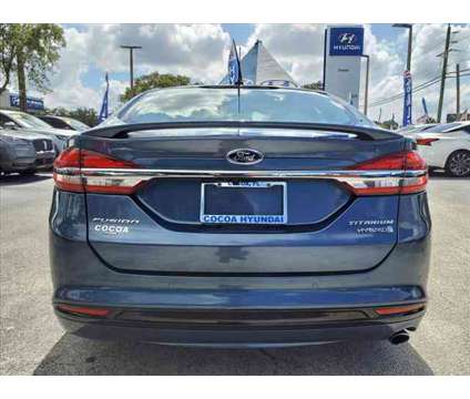 2018 Ford Fusion Hybrid Titanium is a Silver 2018 Ford Fusion Hybrid Titanium Hybrid in Cocoa FL