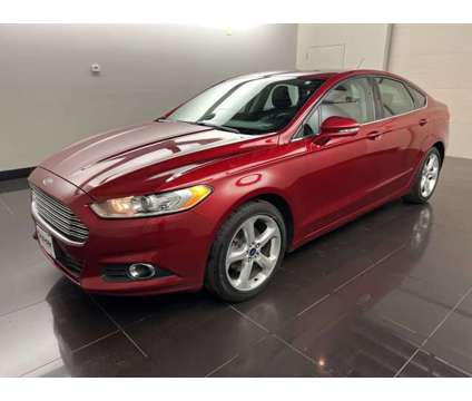 2016 Ford Fusion SE is a Red 2016 Ford Fusion SE Car for Sale in Madison WI