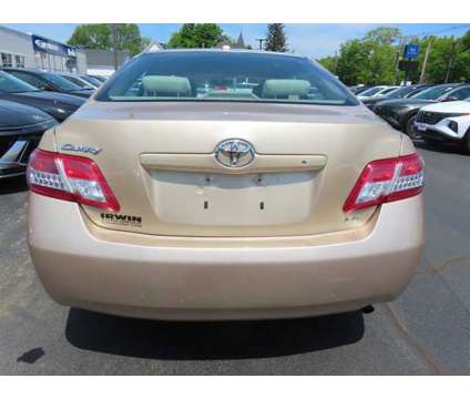 2010 Toyota Camry LE is a Gold 2010 Toyota Camry LE Car for Sale in Laconia NH