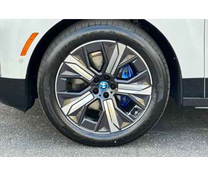 2024 BMW iX xDrive50 is a White 2024 BMW 325 Model iX SUV in Seaside CA