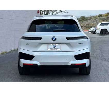 2024 BMW iX xDrive50 is a White 2024 BMW 325 Model iX SUV in Seaside CA