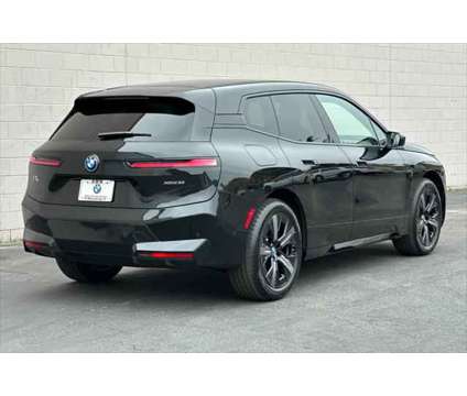 2025 BMW iX xDrive50 is a Black 2025 BMW 325 Model iX SUV in Seaside CA