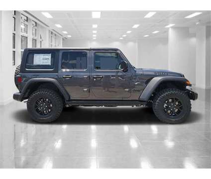 2024 Jeep Wrangler Willys is a Grey 2024 Jeep Wrangler Car for Sale in Orlando FL