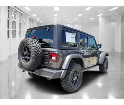 2024 Jeep Wrangler Willys is a Grey 2024 Jeep Wrangler Car for Sale in Orlando FL