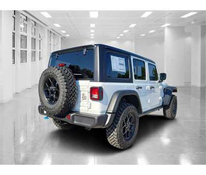 2024 Jeep Wrangler Willys 4xe is a White 2024 Jeep Wrangler Car for Sale in Orlando FL