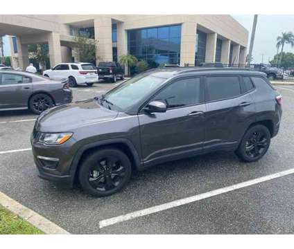 2021 Jeep Compass Altitude is a Grey 2021 Jeep Compass Altitude Car for Sale in Orlando FL