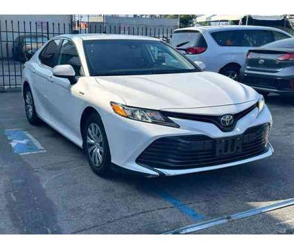 2019 Toyota Camry Hybrid for sale is a White 2019 Toyota Camry Hybrid Hybrid in Arleta CA
