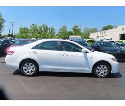 2011 Toyota Camry LE is a White 2011 Toyota Camry LE Car for Sale in Laconia NH