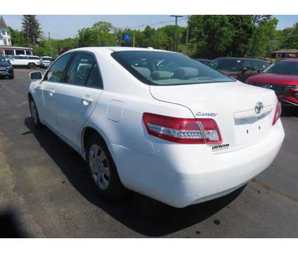 2011 Toyota Camry LE is a White 2011 Toyota Camry LE Car for Sale in Laconia NH