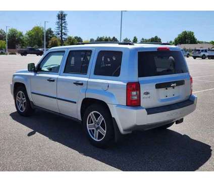 2009 Jeep Patriot Sport is a Silver 2009 Jeep Patriot Sport Car for Sale in Denver CO