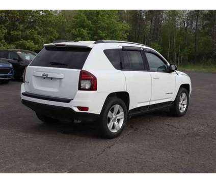 2016 Jeep Compass Sport is a White 2016 Jeep Compass Sport Car for Sale in Traverse City MI