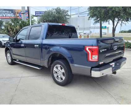 2015 Ford F-150 XLT is a Blue 2015 Ford F-150 XLT Truck in Houston TX