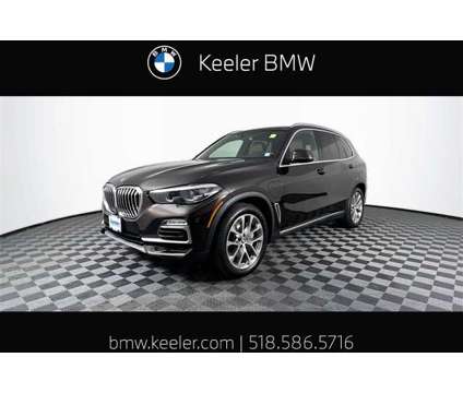 2021 BMW X5 xDrive45e is a Brown 2021 BMW X5 4.8is SUV in Latham NY