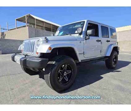 2012 Jeep Wrangler Unlimited Sahara is a Silver 2012 Jeep Wrangler Unlimited Sahara SUV in Henderson NV