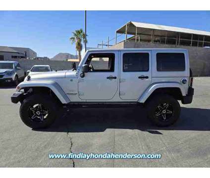 2012 Jeep Wrangler Unlimited Sahara is a Silver 2012 Jeep Wrangler Unlimited Sahara SUV in Henderson NV