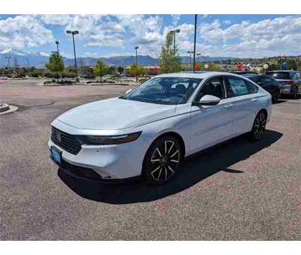 2024 Honda Accord Hybrid Touring is a Silver, White 2024 Honda Accord Hybrid Touring Hybrid in Colorado Springs CO