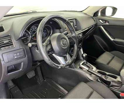 2015 Mazda CX-5 Touring is a Red 2015 Mazda CX-5 Touring SUV in Logan UT