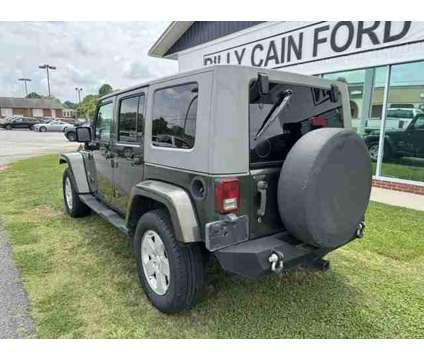 2007 Jeep Wrangler Unlimited Sahara is a Green 2007 Jeep Wrangler Unlimited Car for Sale in Cornelia GA