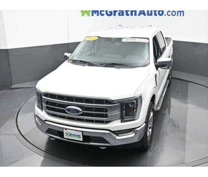 2021 Ford F-150 LARIAT is a Black, White 2021 Ford F-150 Lariat Truck in Dubuque IA