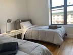 Bed in a twin bedroom, near the Nostrand Av subway
