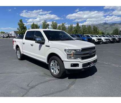 2018 Ford F-150 Platinum is a Silver, White 2018 Ford F-150 Platinum Truck in Logan UT