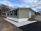 manufactured home boasts a three-bedroom, two-bathroom configuration