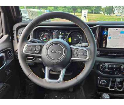 2024 Jeep Wrangler 4xe Sahara 4xe is a Black 2024 Jeep Wrangler SUV in Freehold NJ